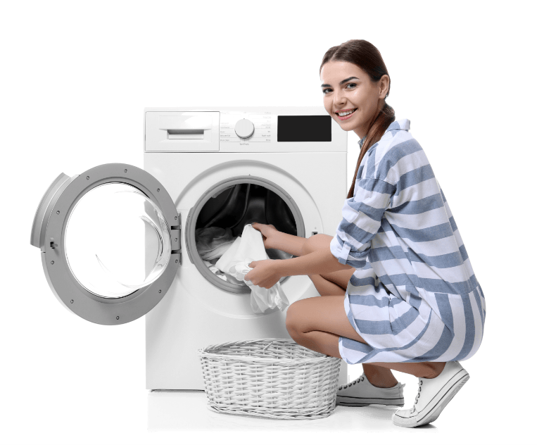 Woman putting clothes in machine washer.